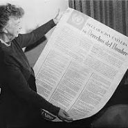 Eleanor Roosevelt holding a poster of the Universal Declaration of Human Rights.